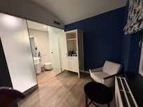 You get two “cells”; one for the bed and the other for shower and a sitting area.