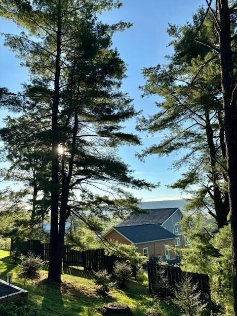 A beautiful sunrise over the main house and through the trees!