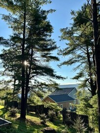 A beautiful sunrise over the main house and through the trees!