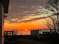 Sunset from beside house over Delaware Bay