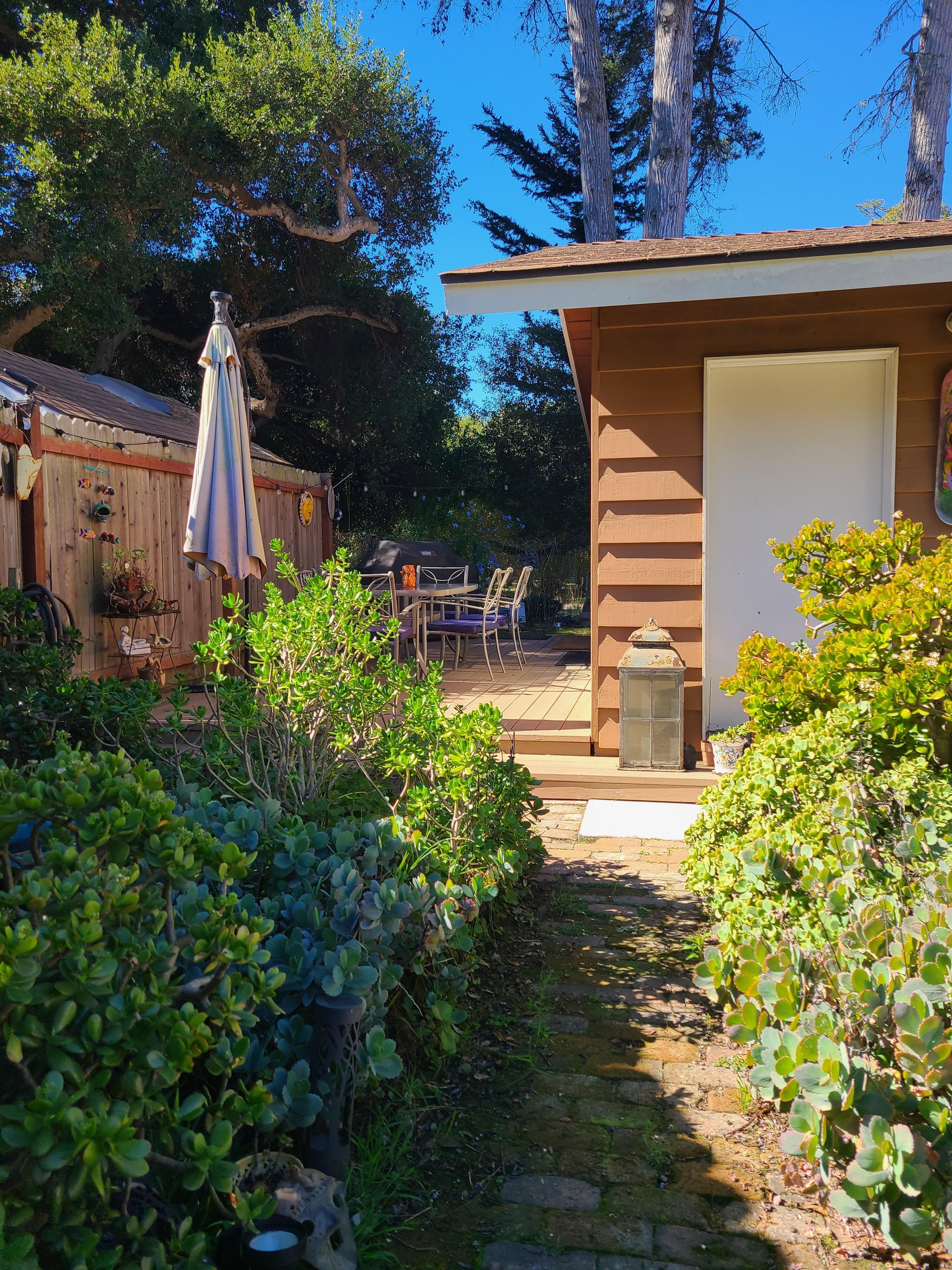 Big wrap around yard with a deck for outside dining and grill.