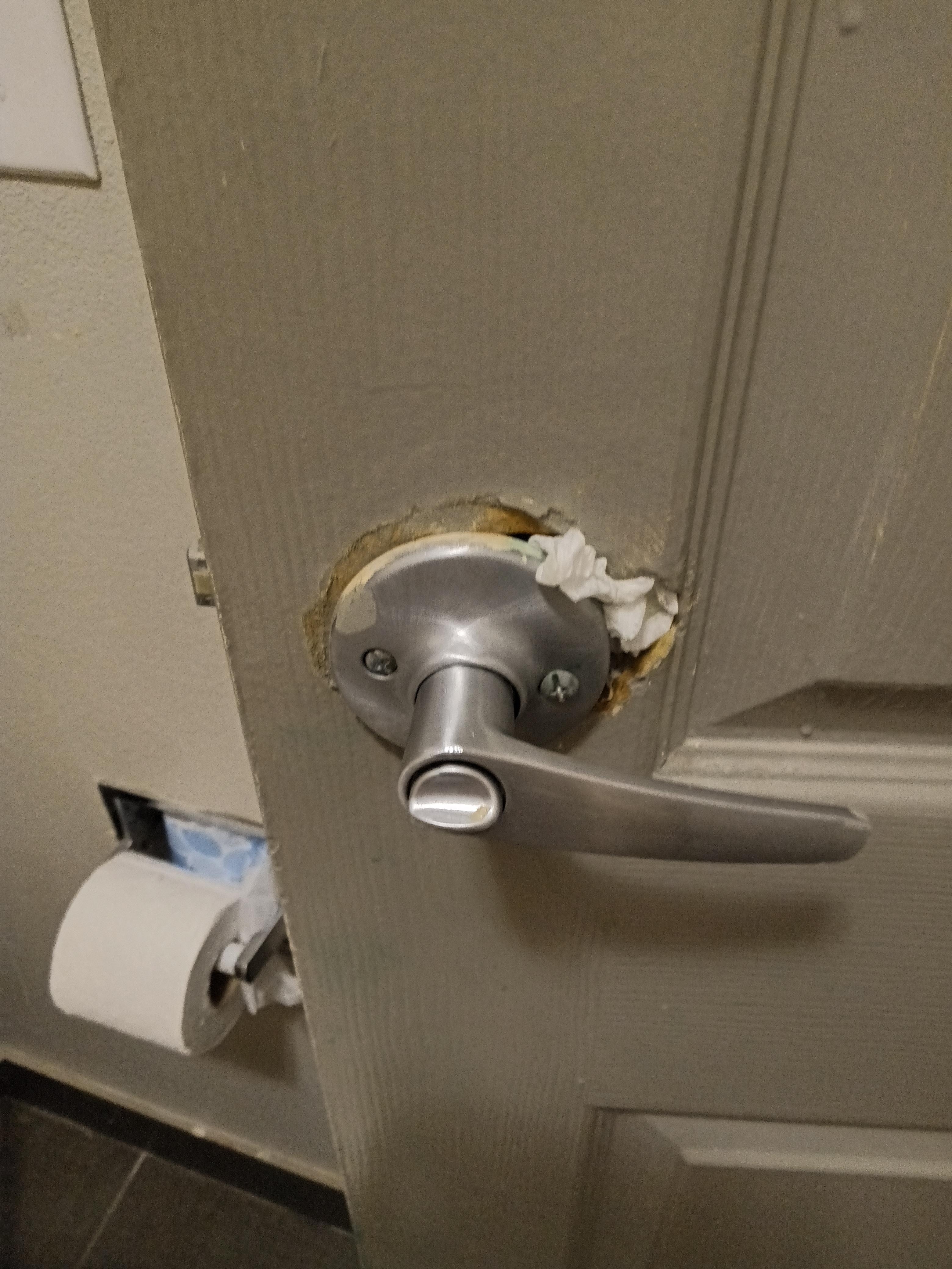 Toilet paper in door hole