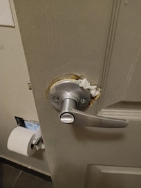 Toilet paper in door hole