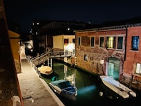 Nighttime view of the quiet canal from Nati’s House balcony