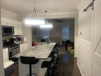 View from the bedroom looking into the kitchen/living room