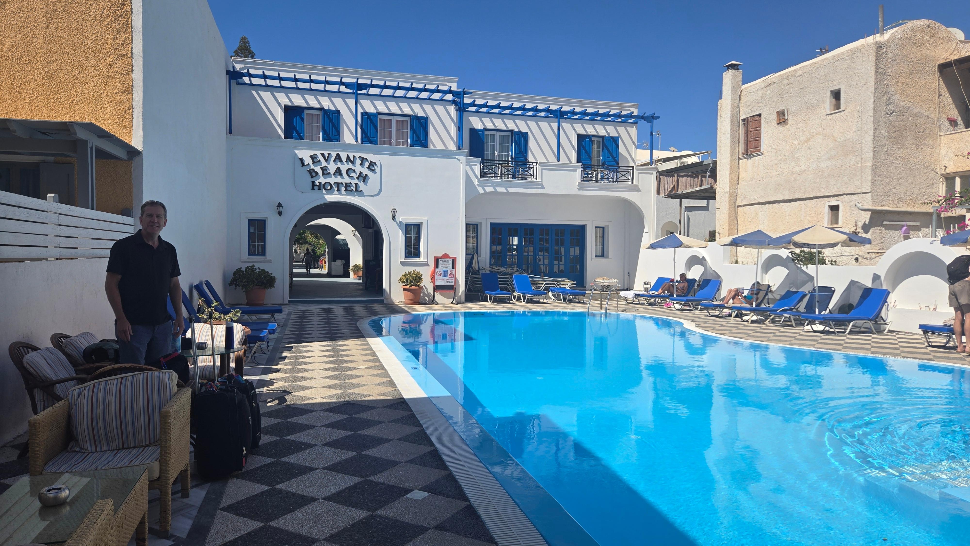Pool area with furniture and a pool shower