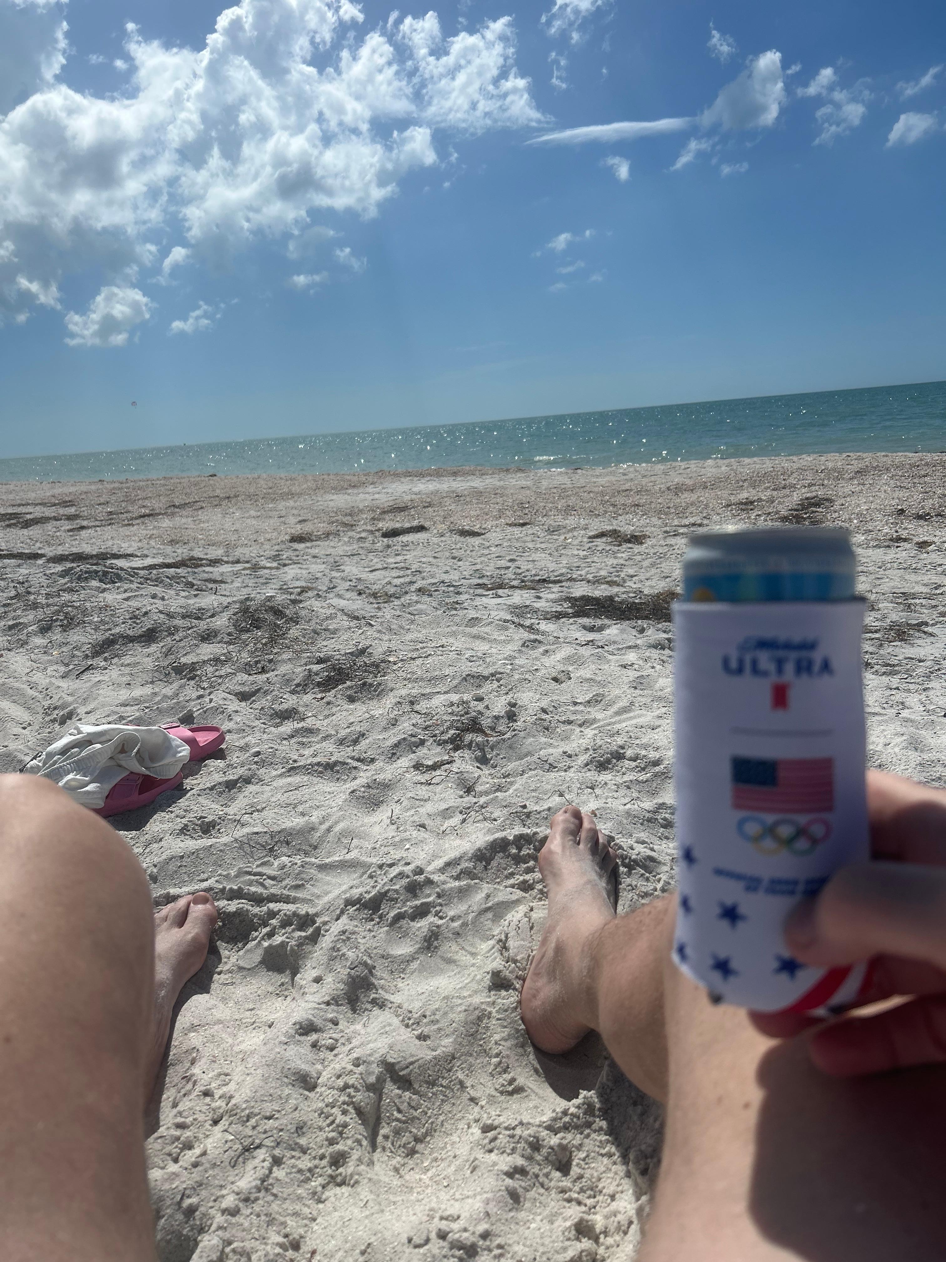 Relaxing at the beach with beach chairs and umbrella supplied. 