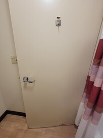 Hole from door hook, water damage to bottom of bathroom door