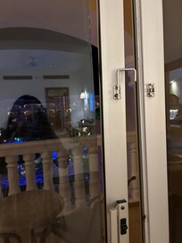 Balcony door held back in place by us so it wouldn't fall out