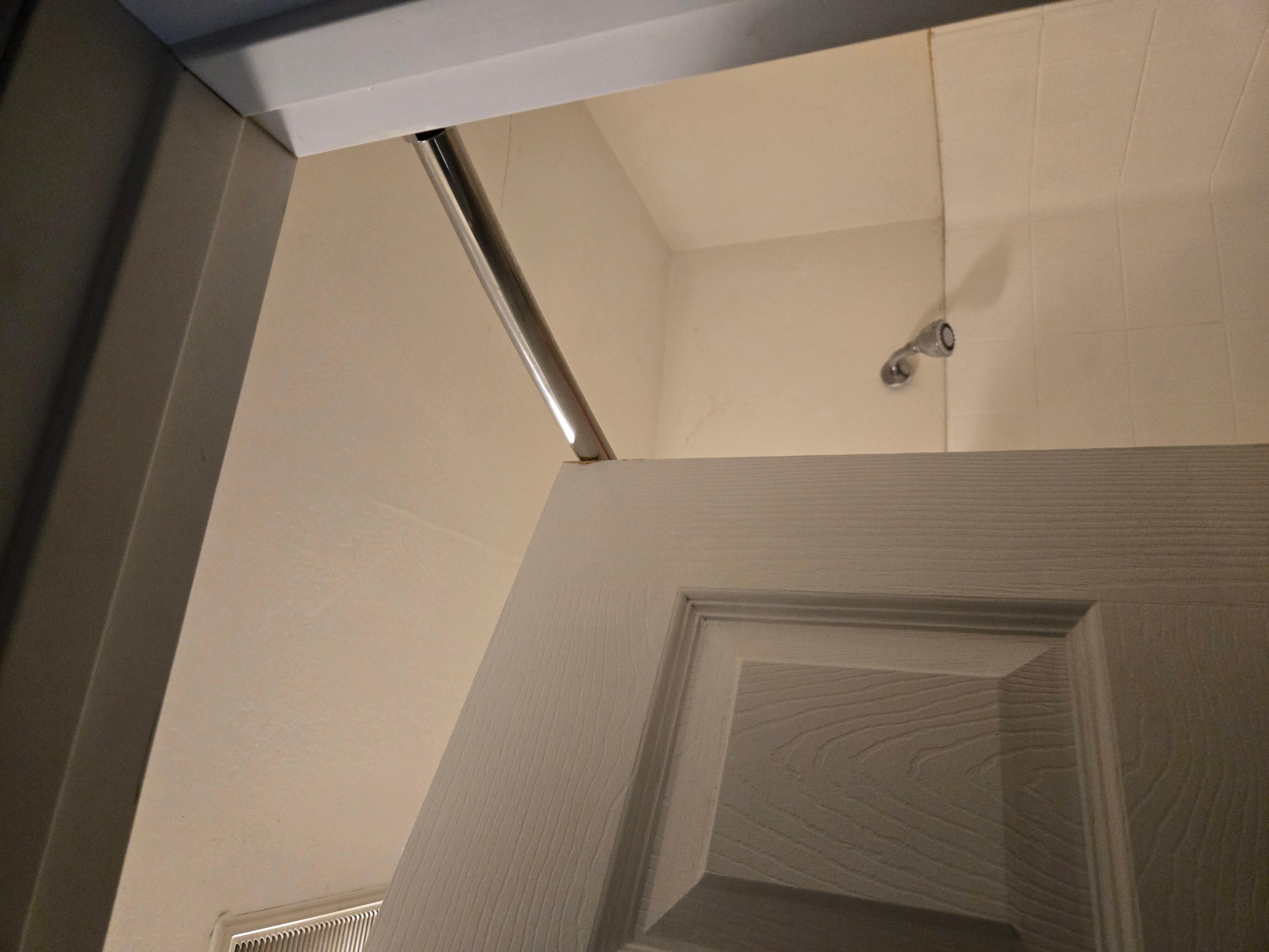 Door hits curtain rod