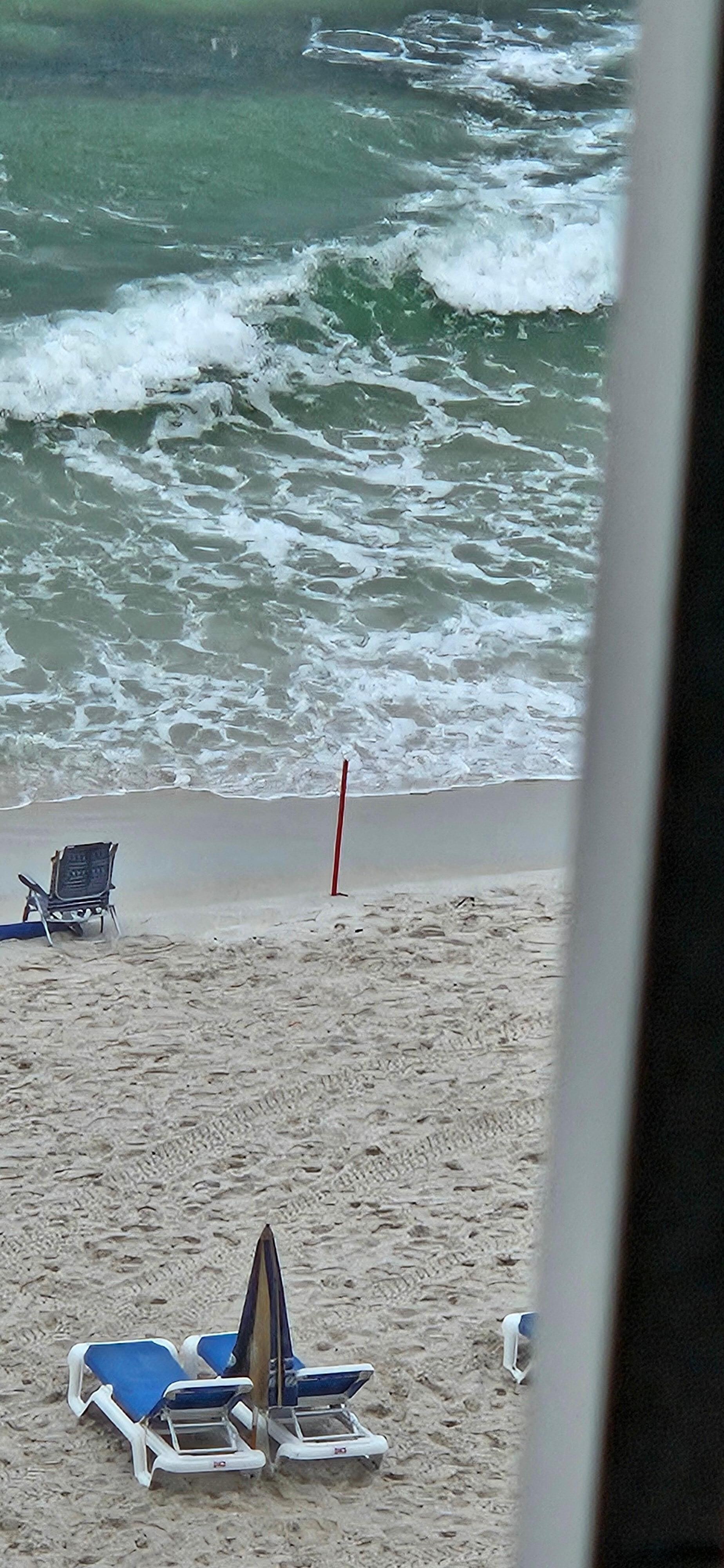 The beach "RED" stick that the people with beach service puts out every morning 