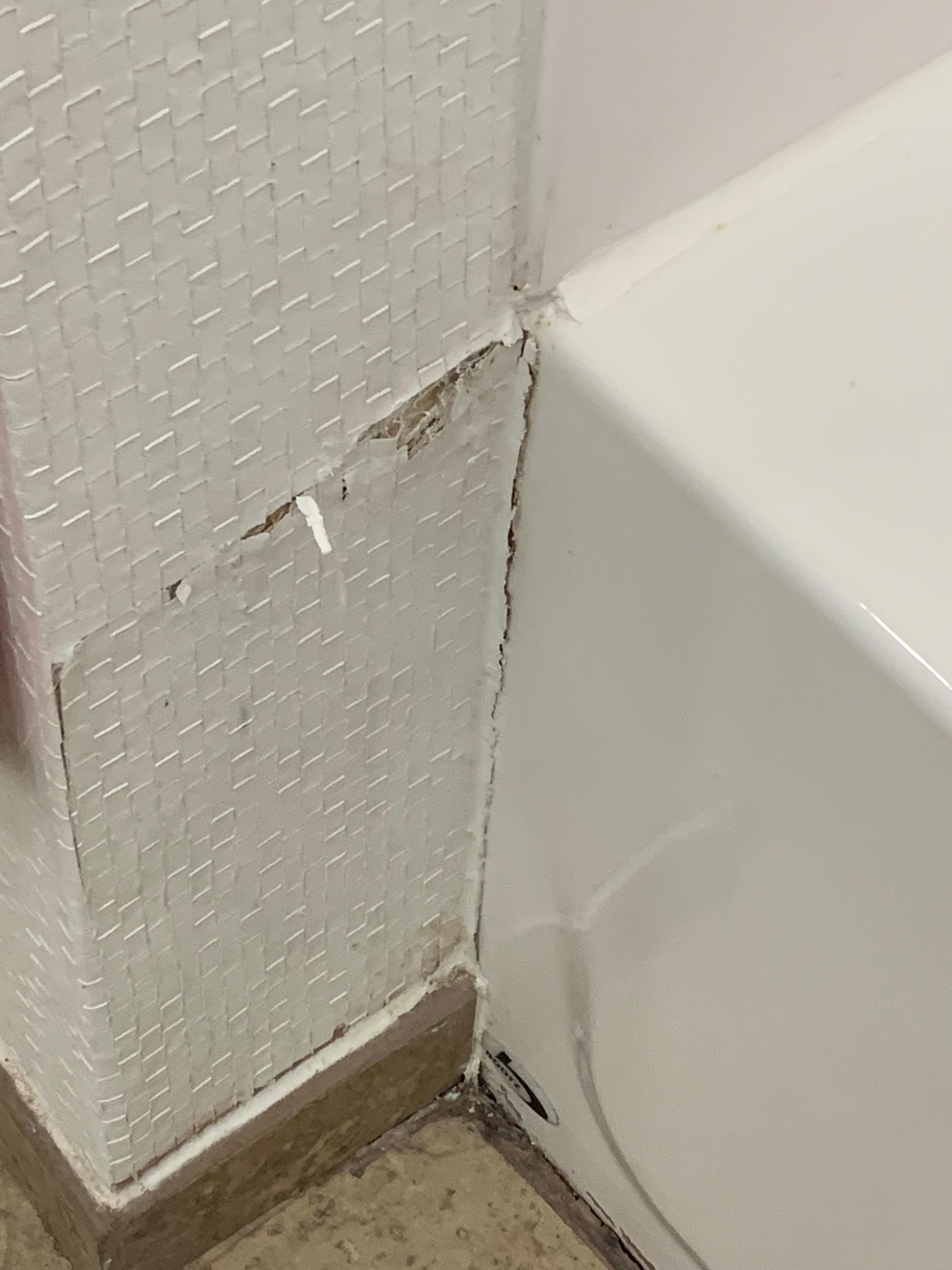Cracked wallpaper and moldy at the base