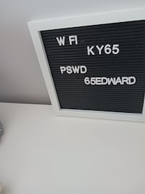 Improper wi-fi access code posted in the living room.