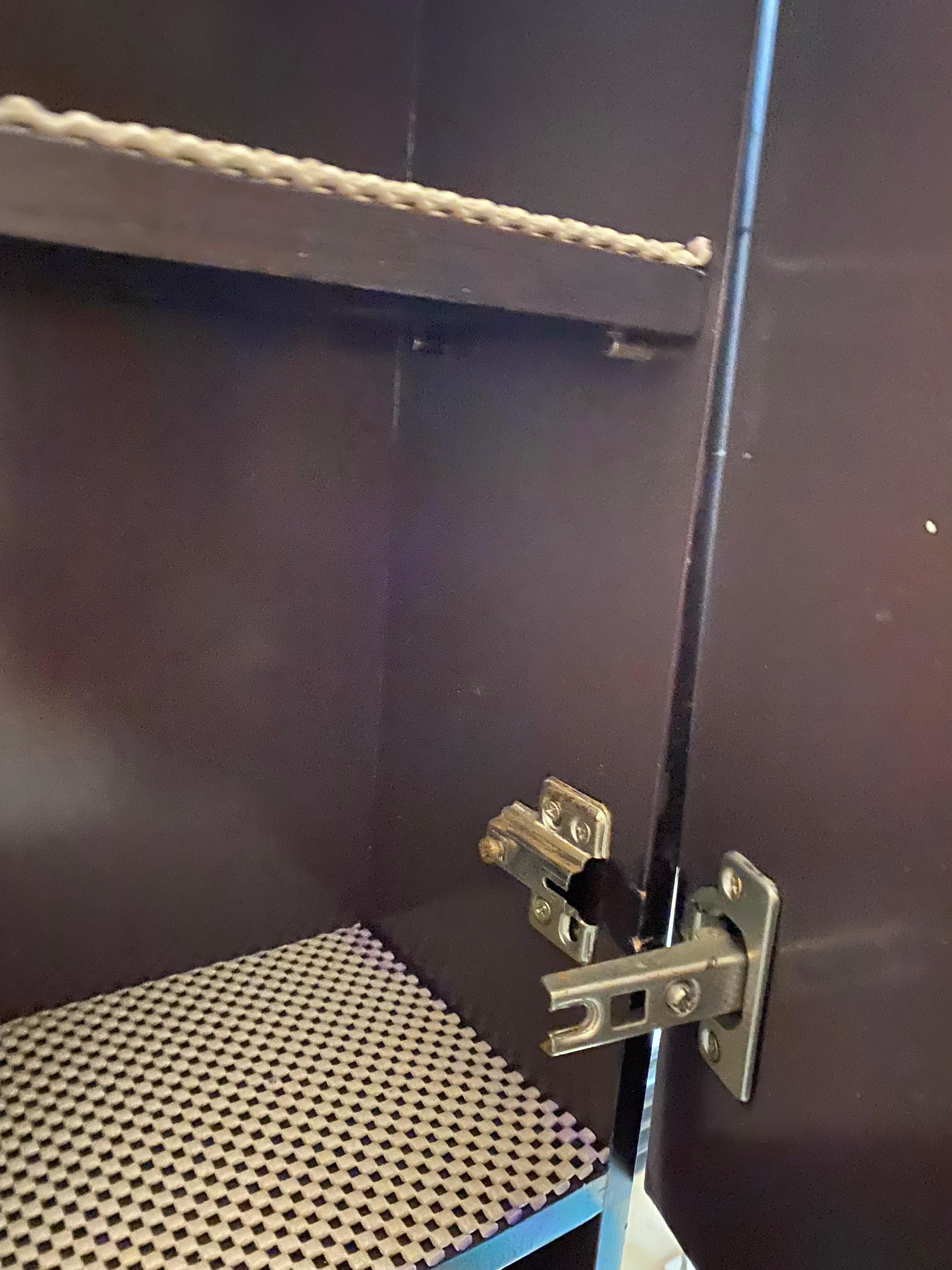 Broken door on cabinet in bathroom