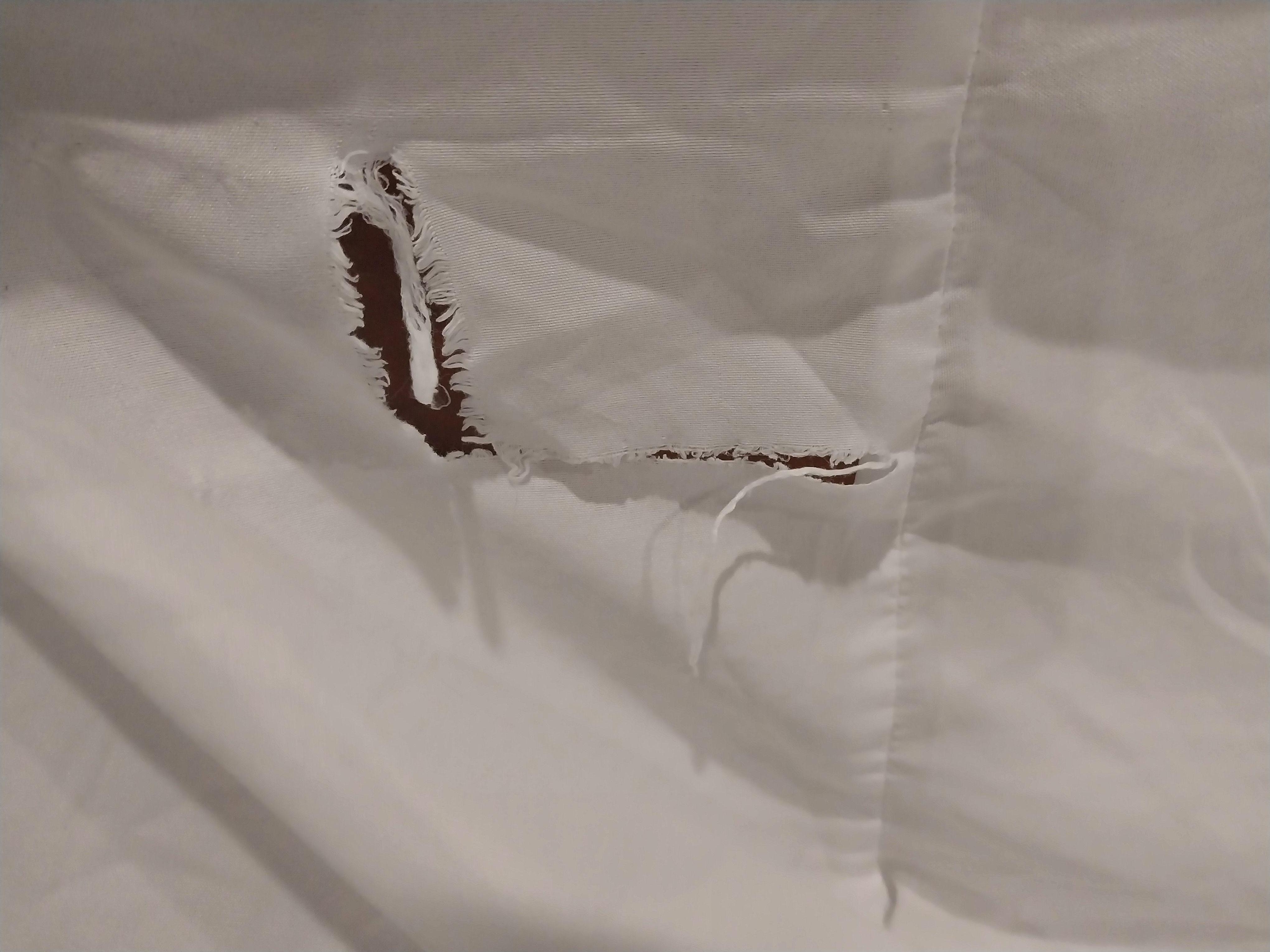 Torn bed sheet