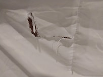 Torn bed sheet
