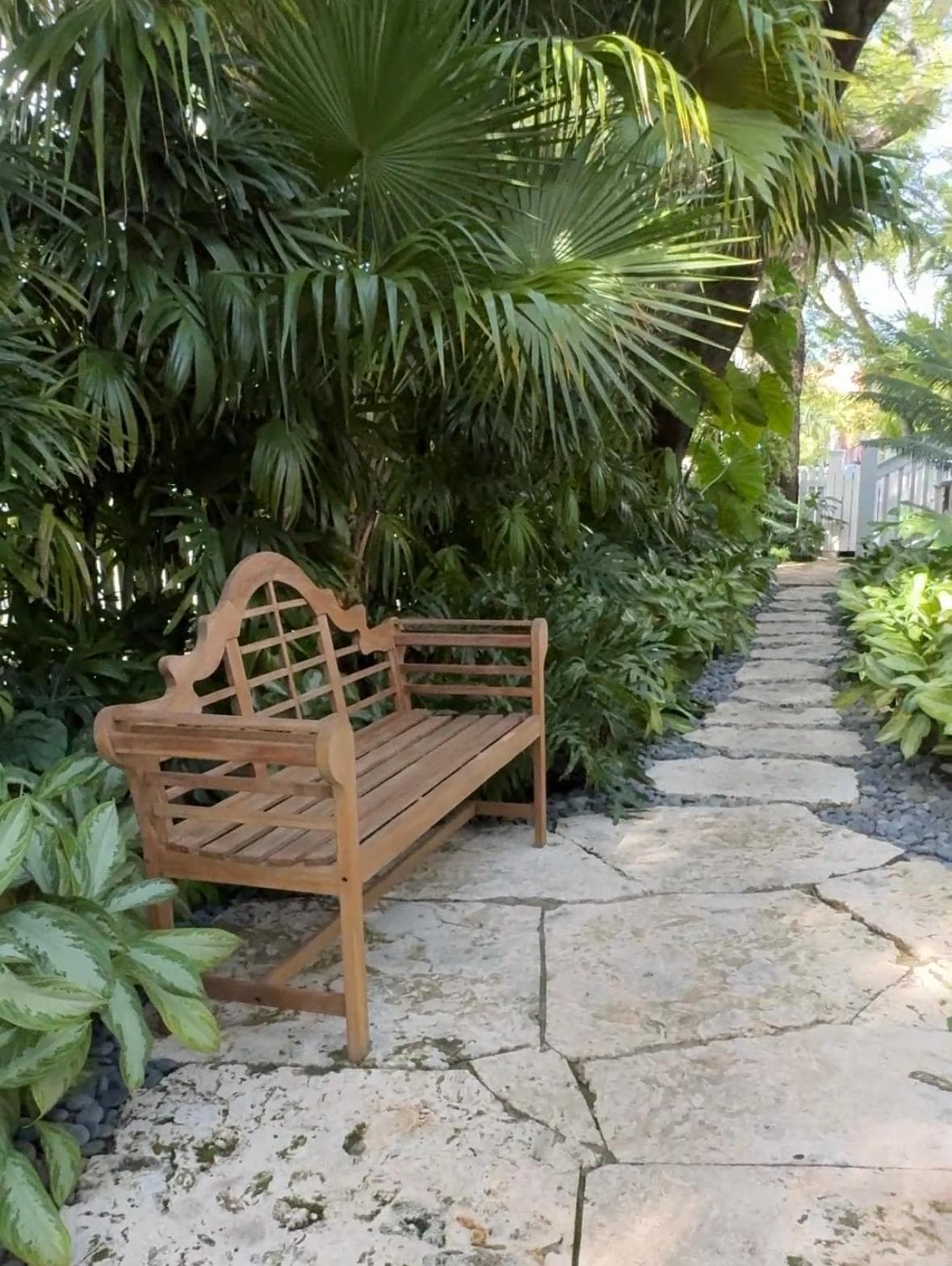 This teak bench was tucked away on a short pathway to our room across from a small water feature. 