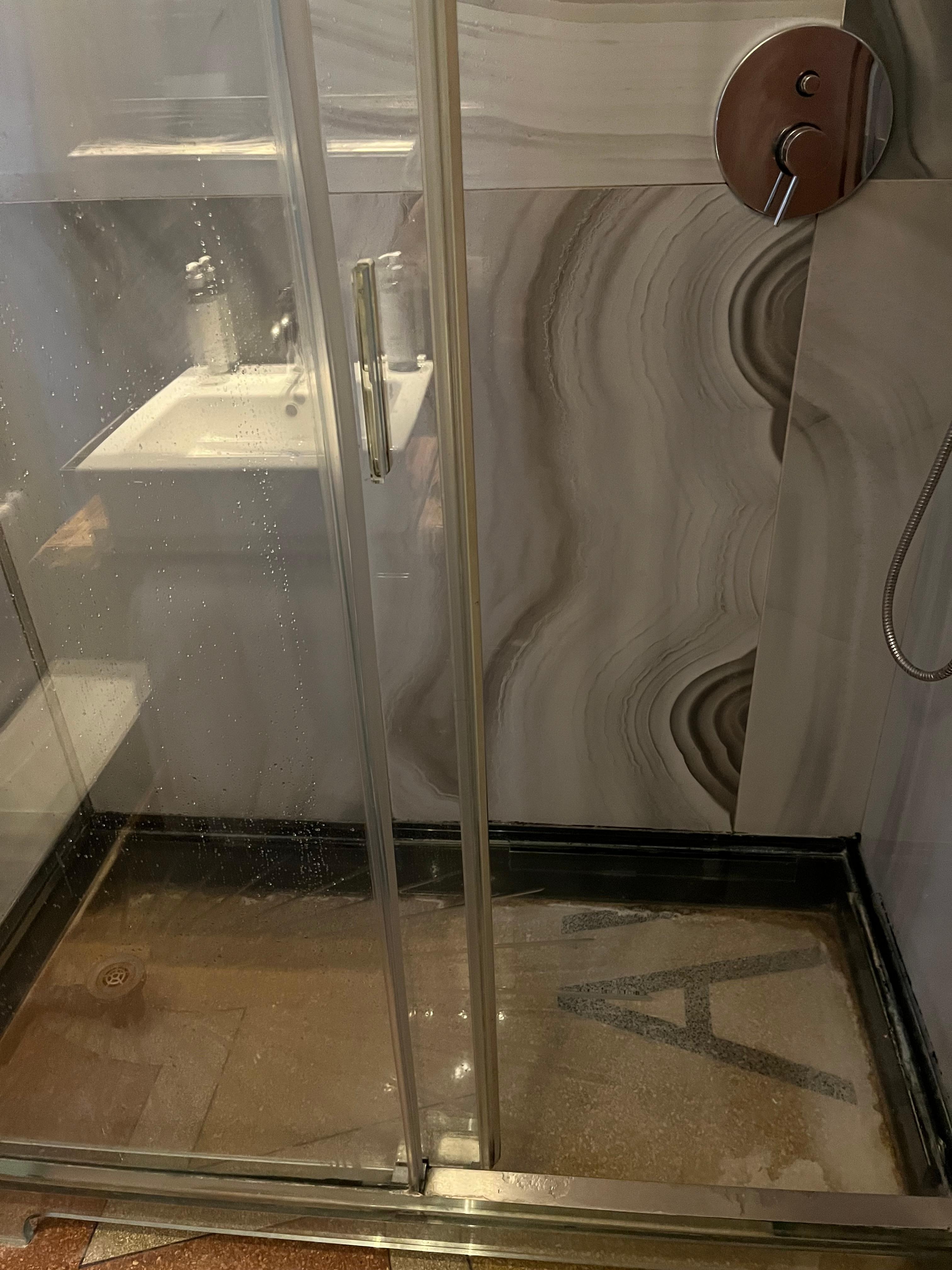 Glass floor of shower over original floor 