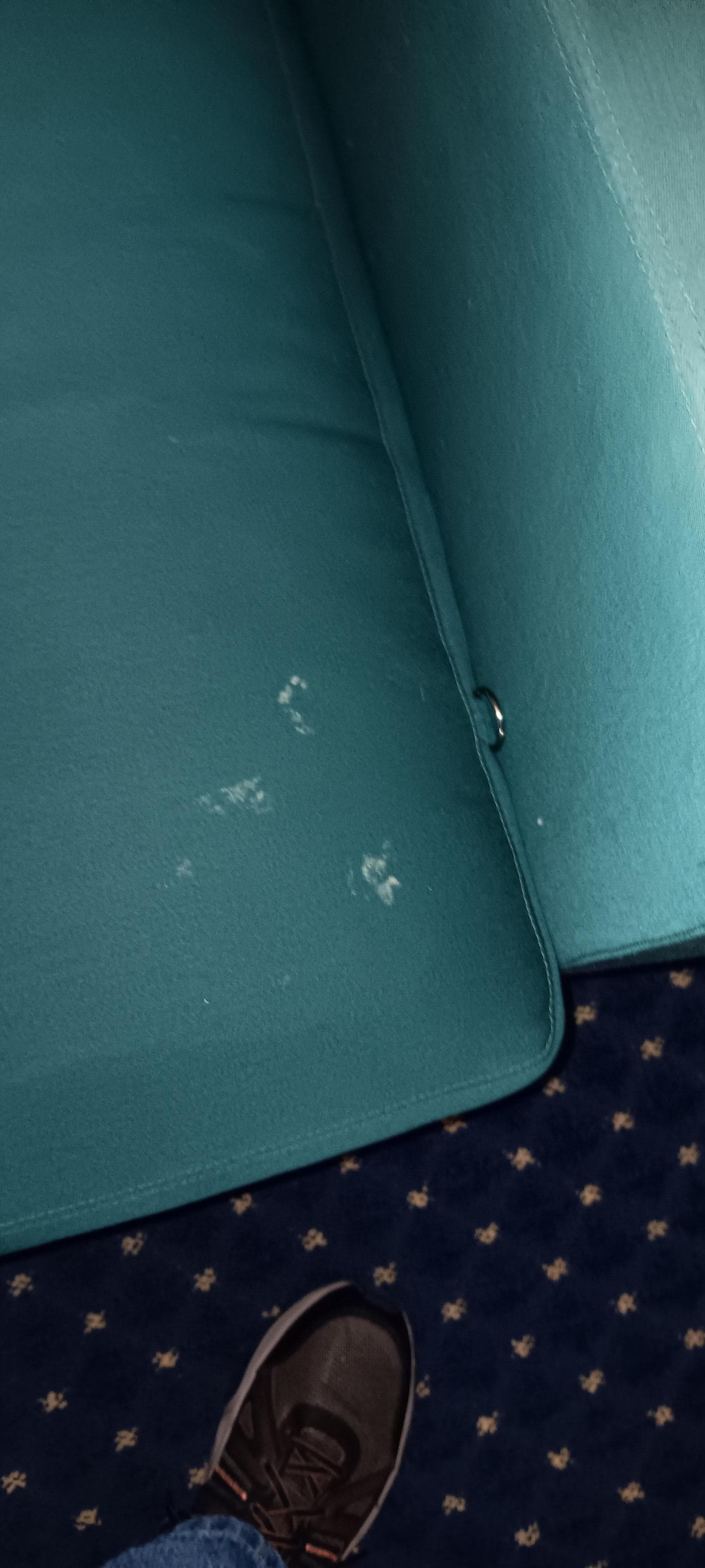 Blue chair with questionable human fluids?