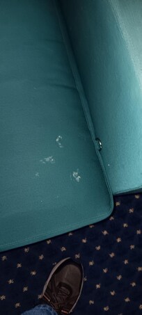 Blue chair with questionable human fluids?