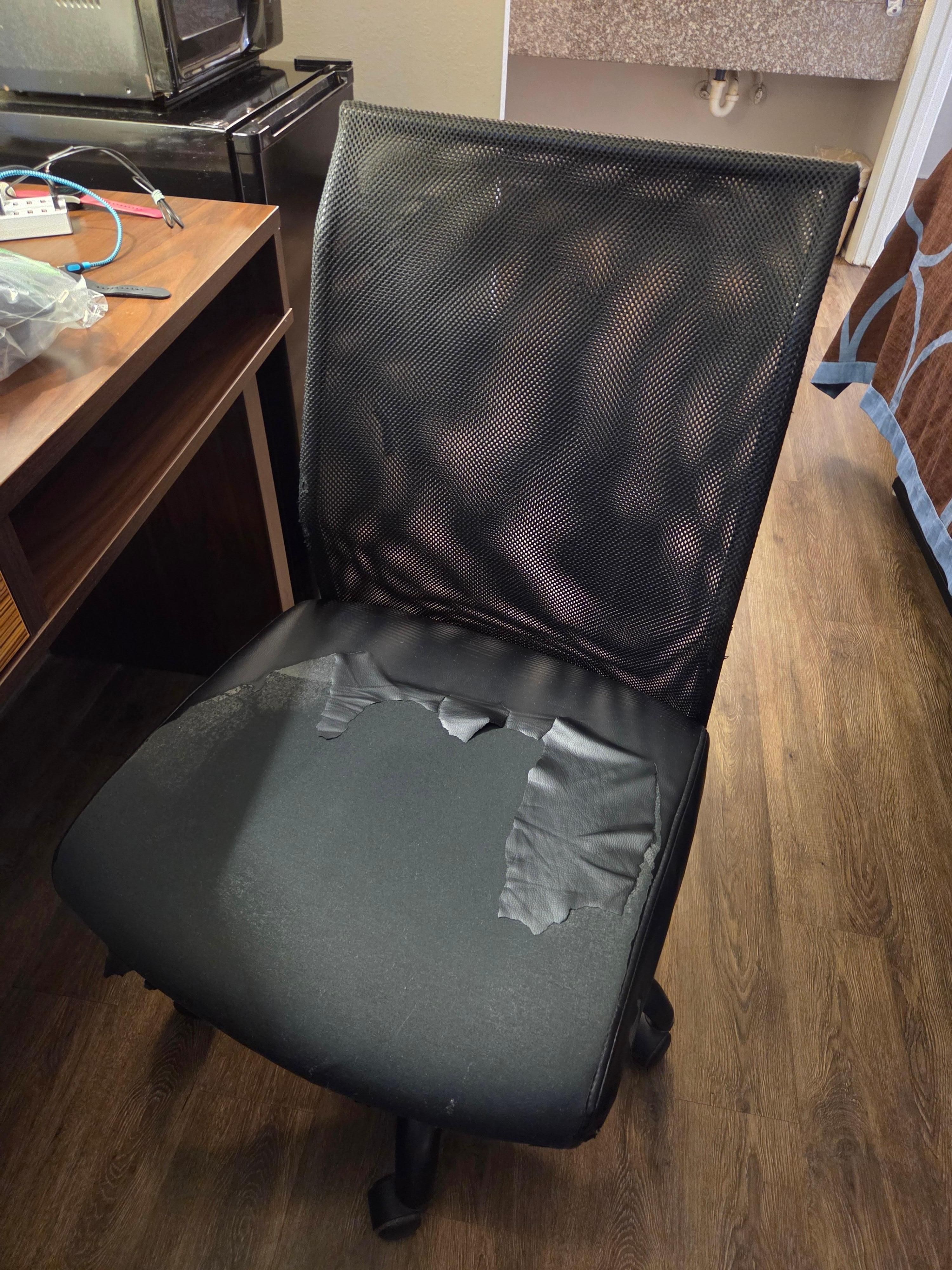Desk chair with ripped and missing search cover