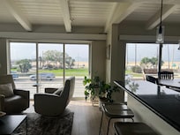 The doors on the left slide open completely for an open-air experience plus great views of Seal Beach Pier.