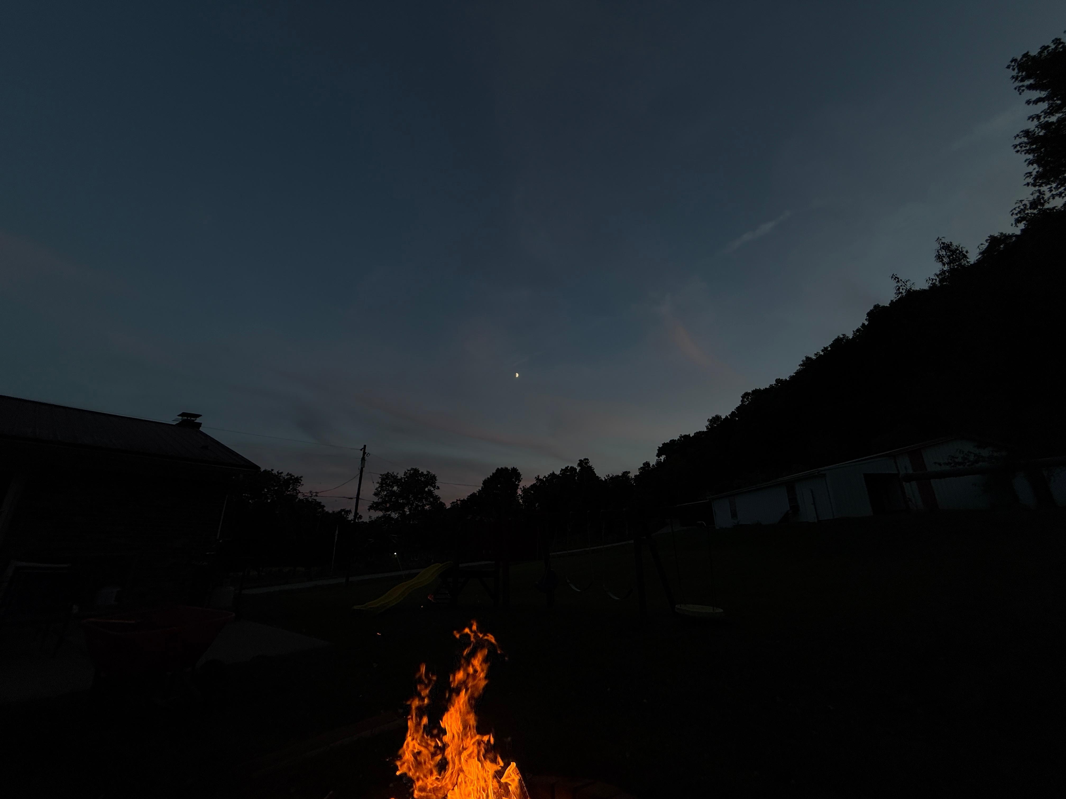 Sitting behind the house with a view of the night sky, and an amazing fire