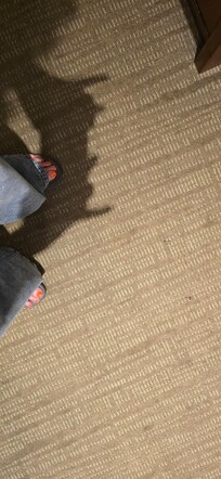 Open safety pin on the floor.