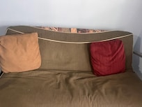 The food town which served at a couch was not comfy and could not be used as a bed as there were no sheets, blankets, or extra pillow