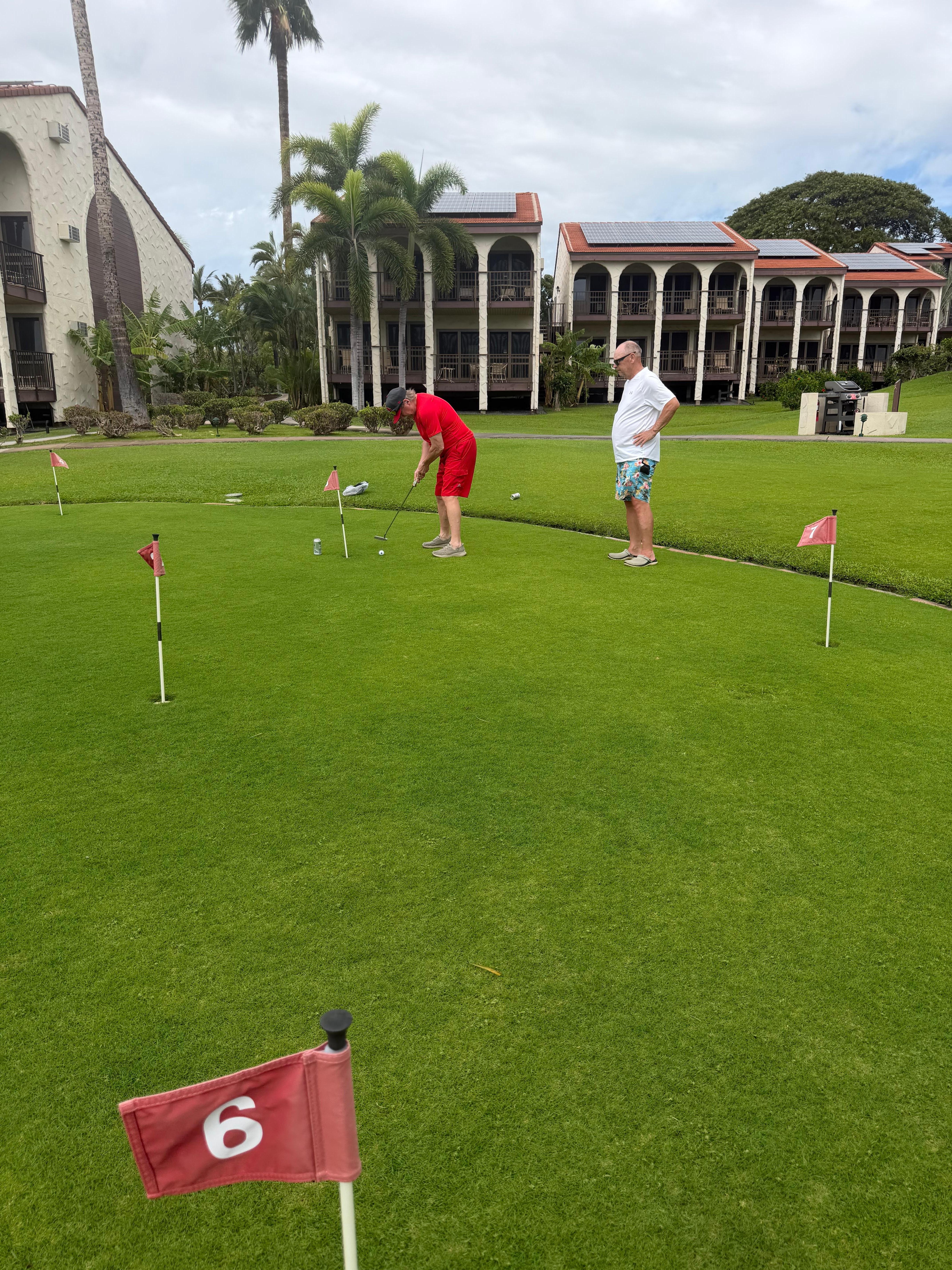 At the putting green by the pool