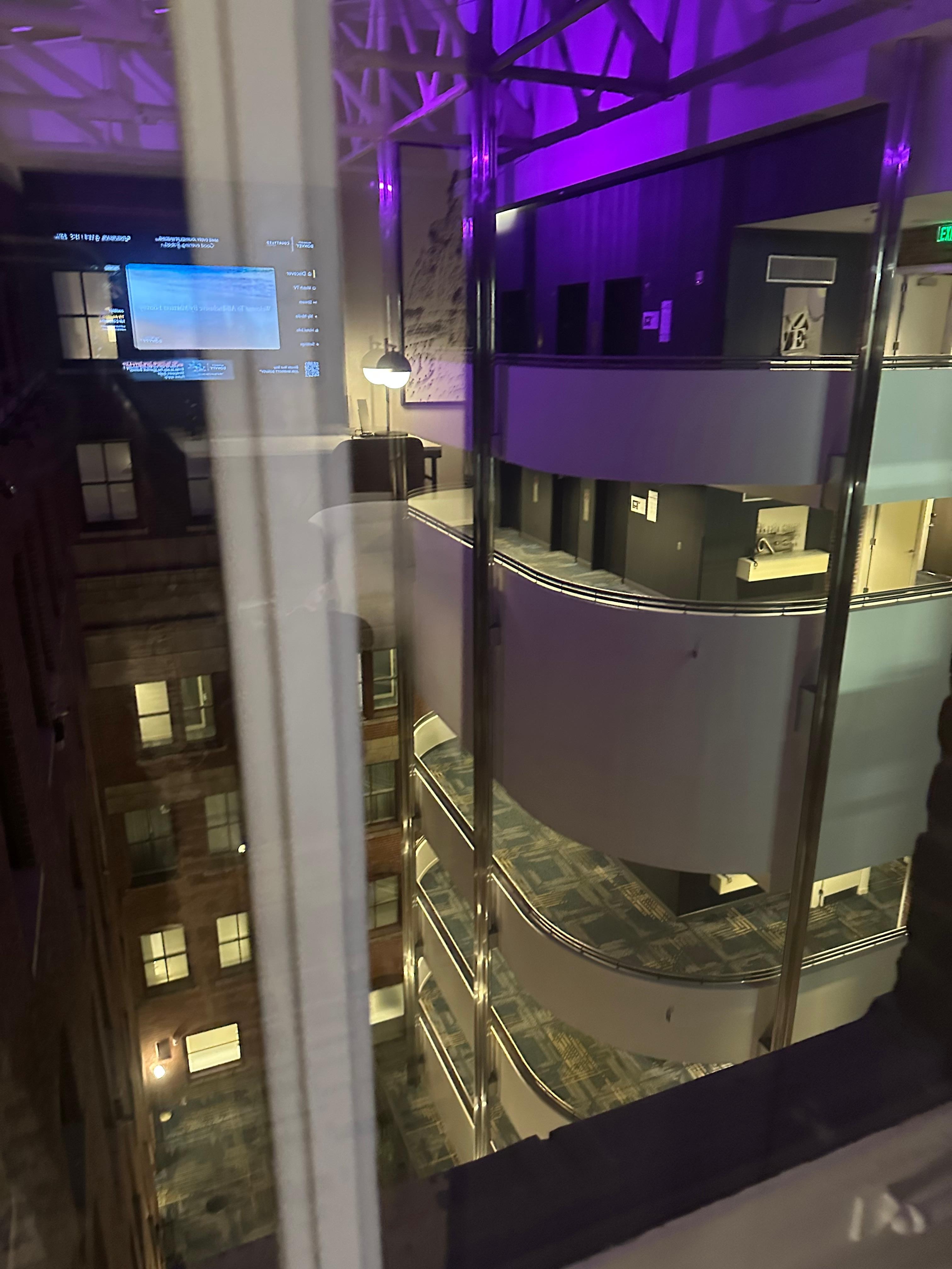 Taking a picture of a beautiful shop out of the window in a hotel