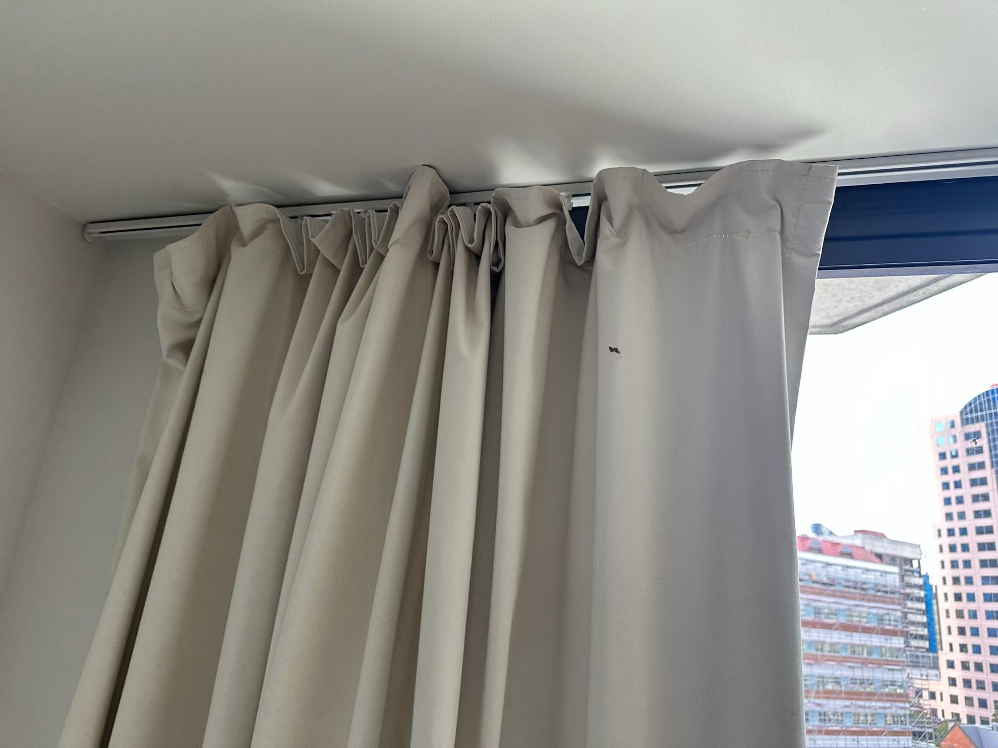 Curtain ripped and not hanging properly