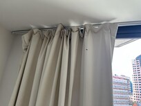 Curtain ripped and not hanging properly