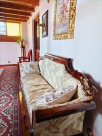 Sofa for sipping whiskey in the third-floor corridor.