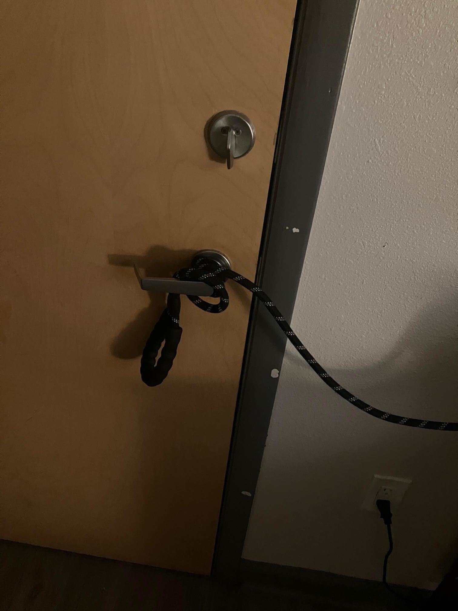 Pass through door could not be locked. This was lashed to the lamp to pull it off the table to break as an alarm. See 6, above.