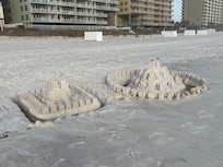 Sand castles on a beach walk