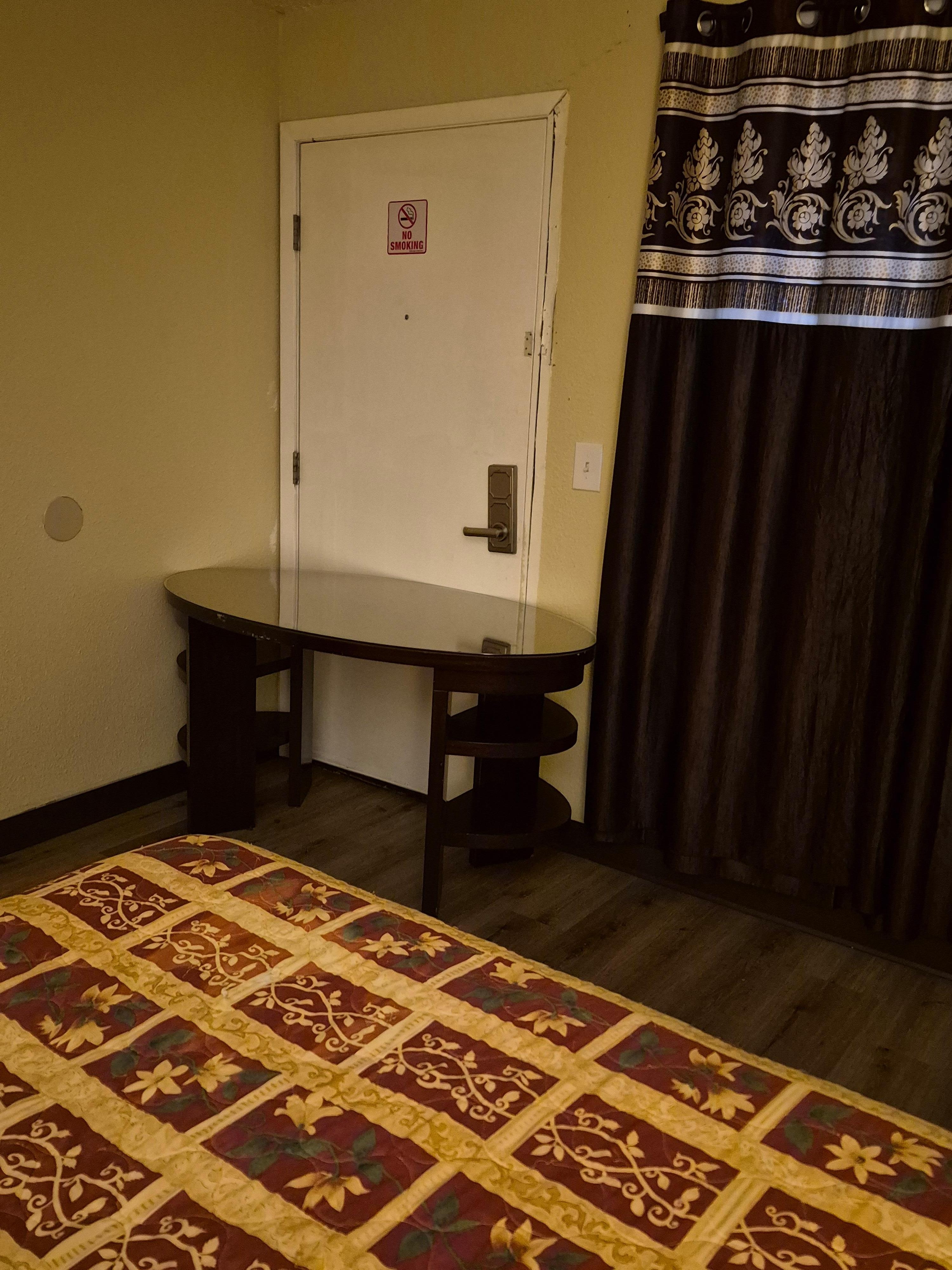 This was before I added the heavy chair to secure the door also. As you can see NO locks on the doorknob and lock on upper door had been removed. 