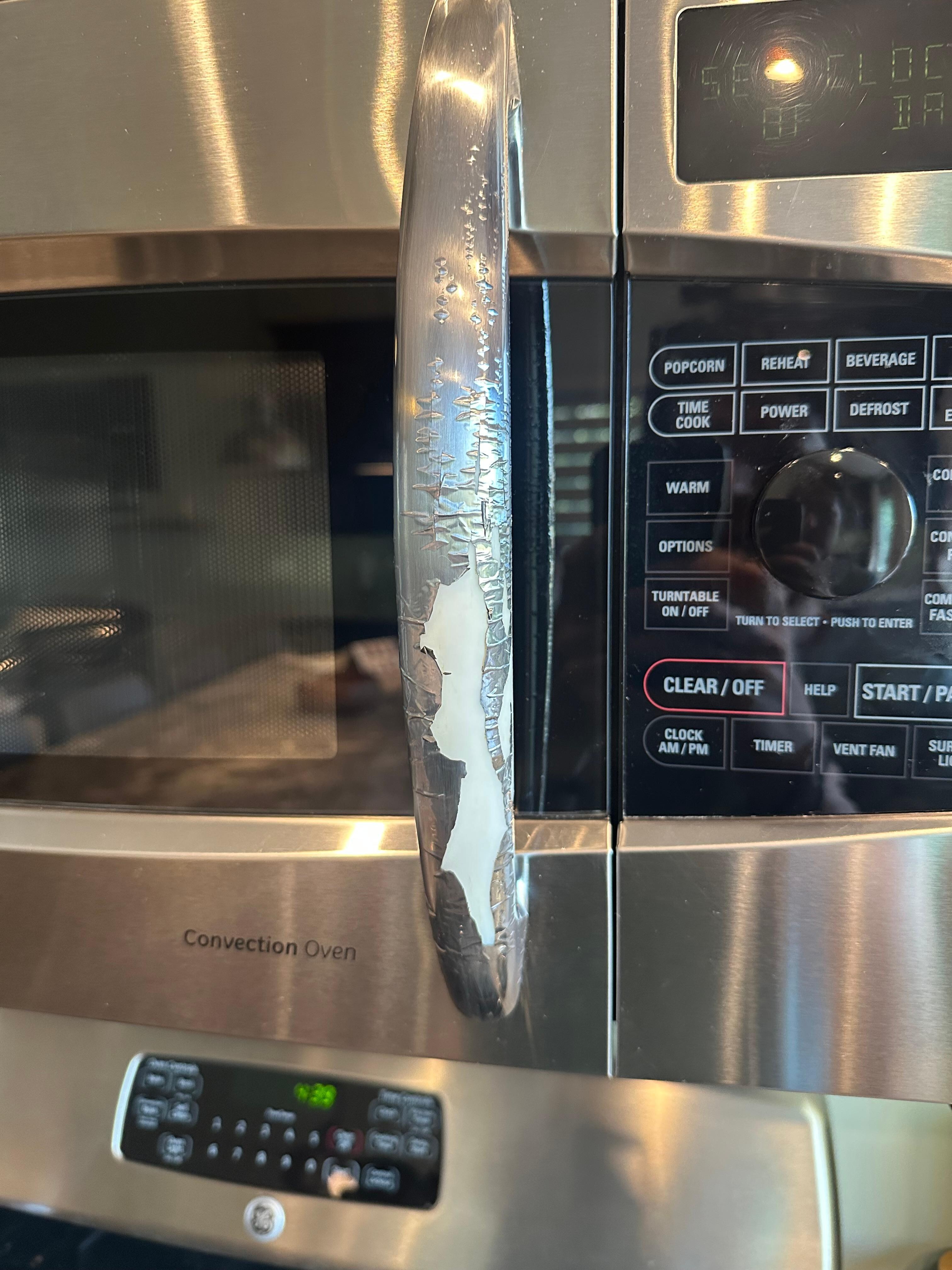 The handle of the microwave is peeling. Inside of the fridge was dirty.