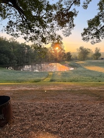 View of the pond during morning sunrise.