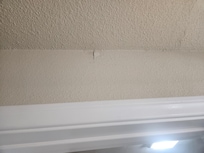 Damage extends outside of bathroom into sink area inside room