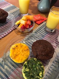 Delicious breakfast, fresh fruit, 2 different quiches, banana nut muffin, OJ, coffee!