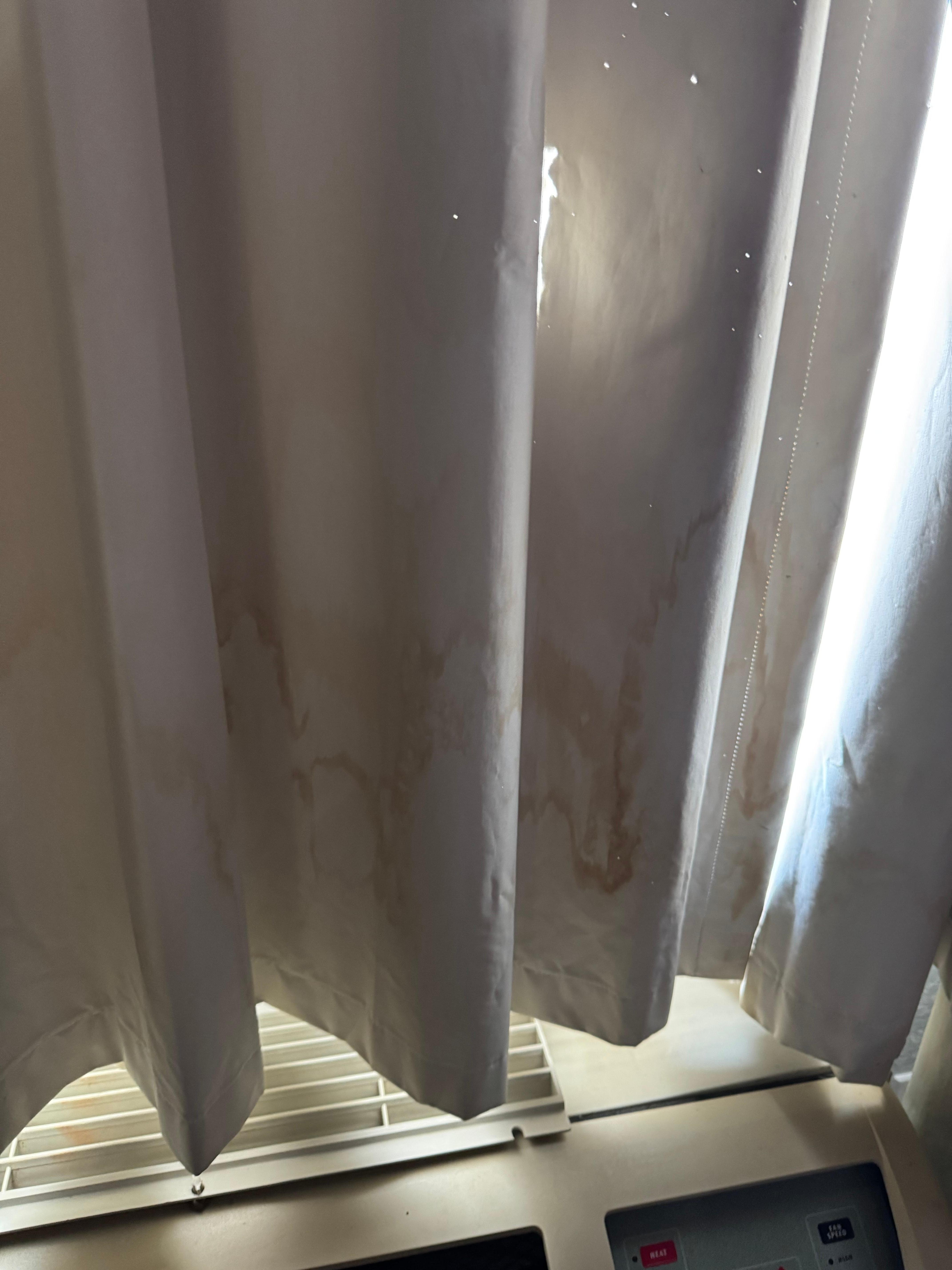 Brown stains along all the curtains. 
