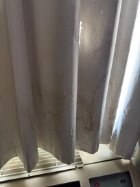 Brown stains along all the curtains.