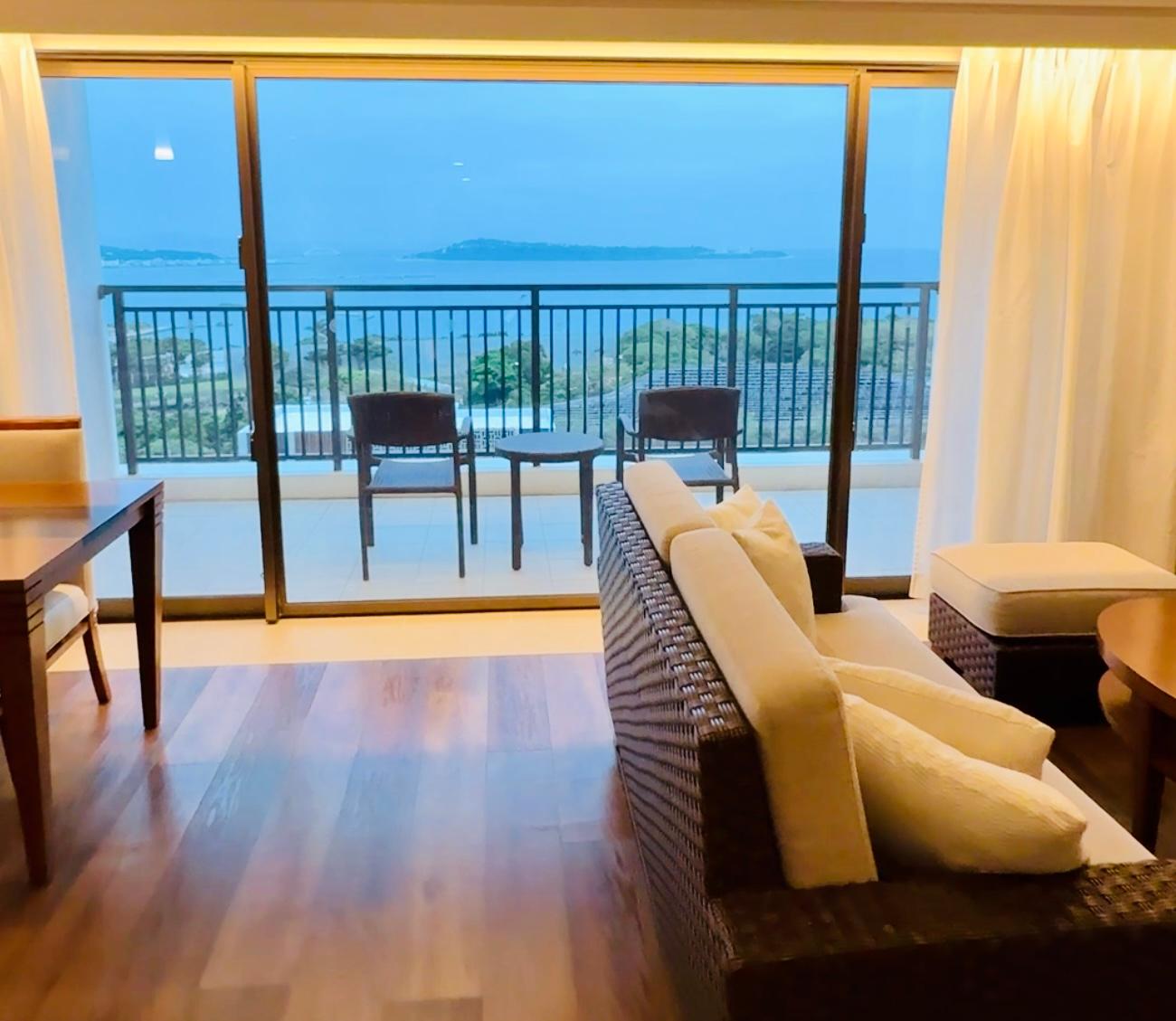 Living room, kitchen and dining area, and balcony with sea and pool view
