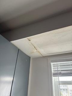 Active roof leak. Upon arrival stream of water dripping from ceiling and in bedroom closet.