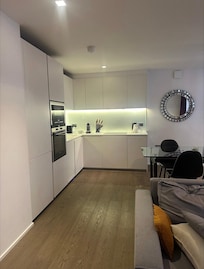Listing photos show a window in the kitchen