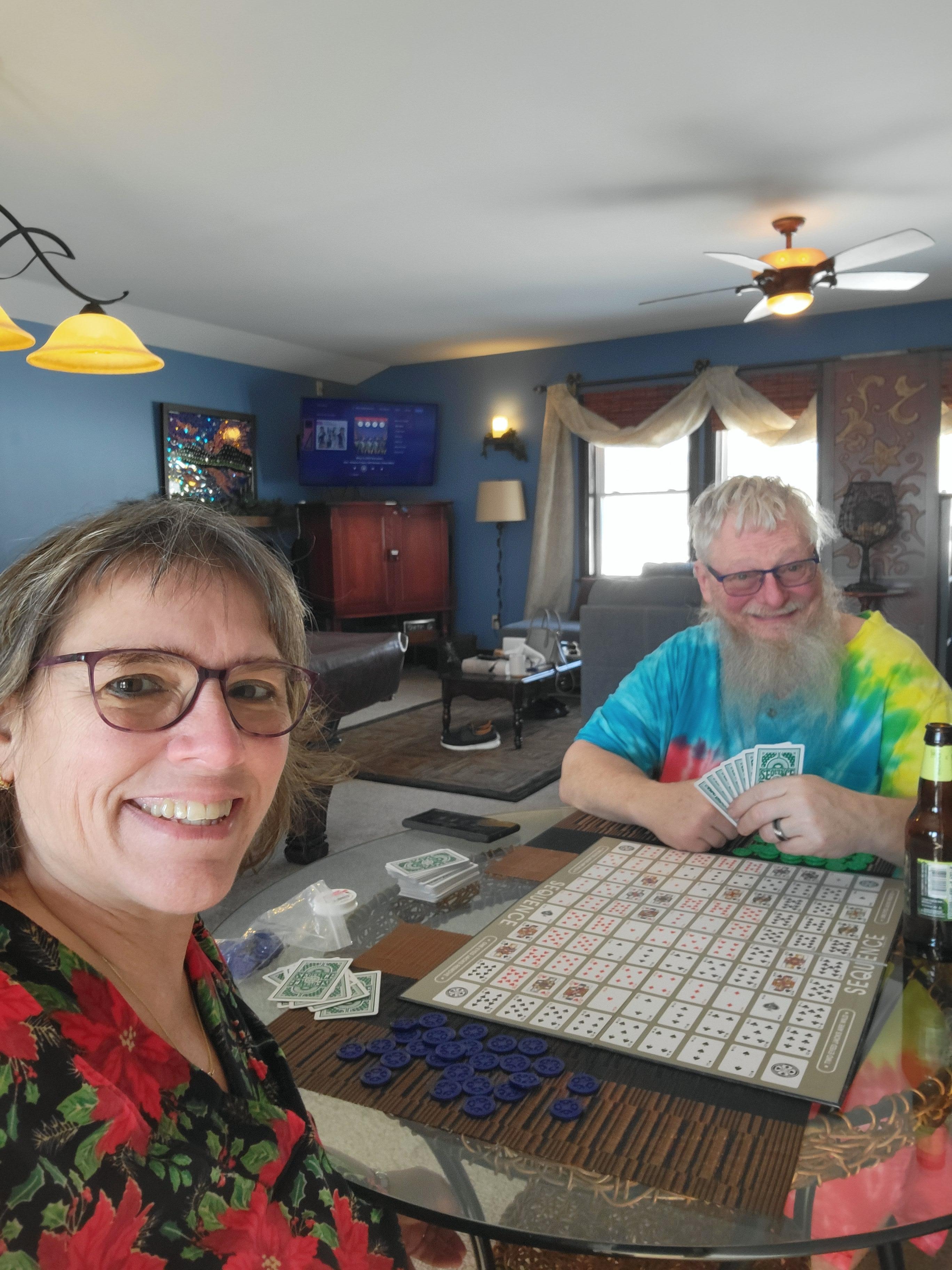 A look into the living room with us sitting at the kitchen table playing a board game we brought