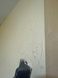 Bubble above shower rod.