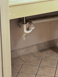 Tape holding pipes together in the bathroom