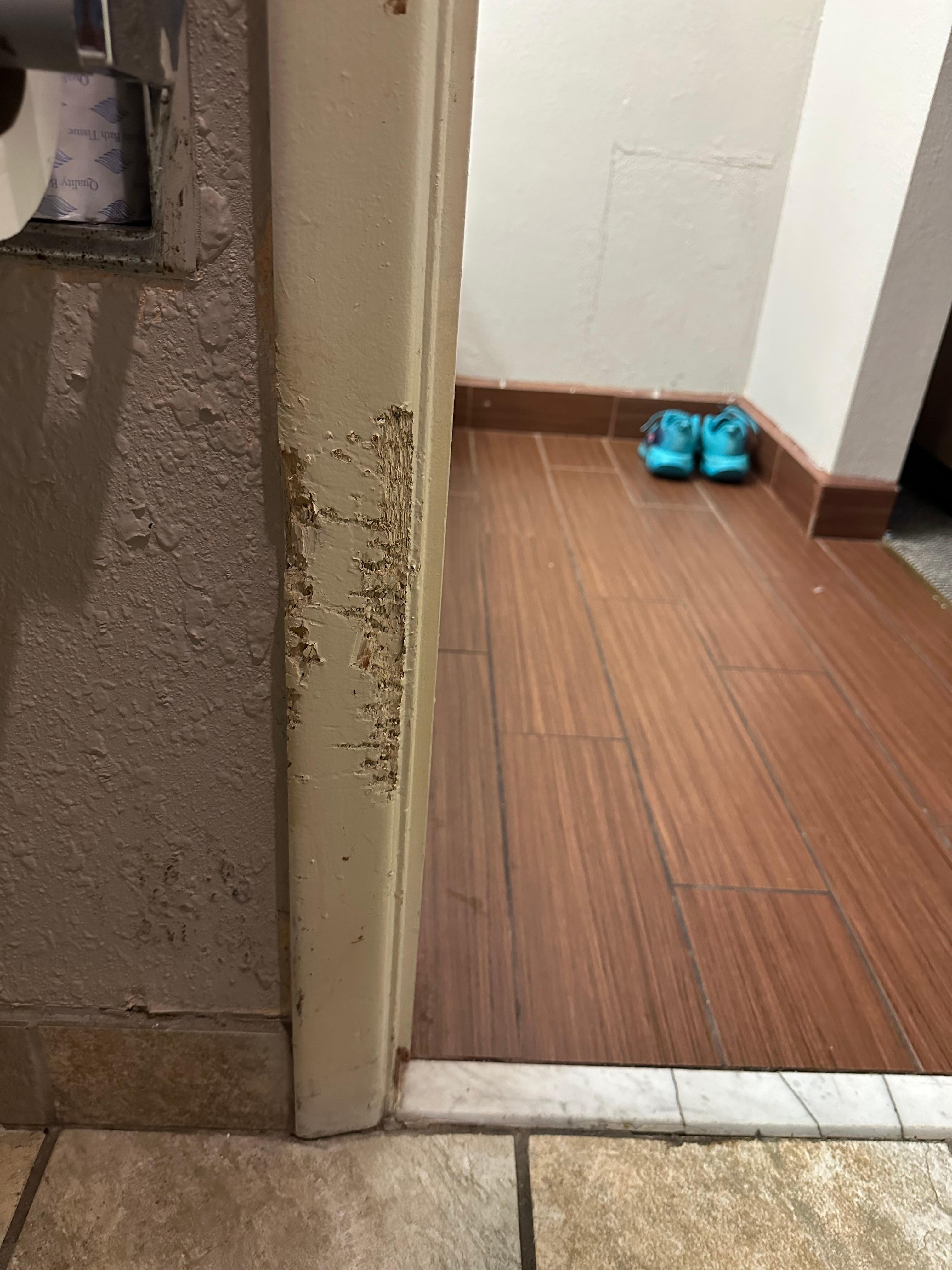 Inside door frame in bathroom